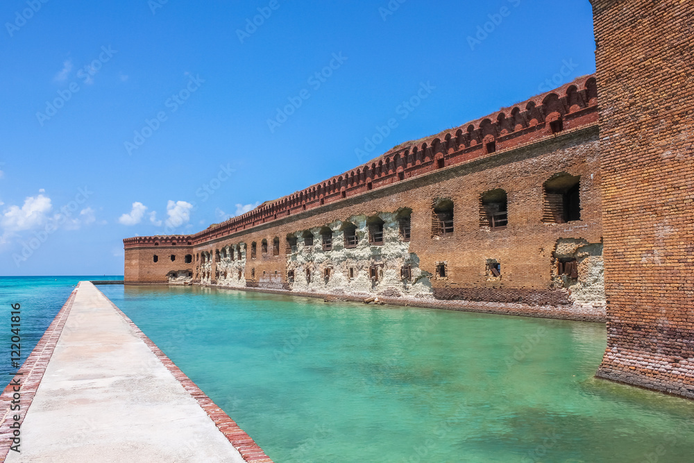 Northern Side of Fort Jefferson on Dry Tortugas National Park, Florida. The brick moat around Fort Jefferson with the crystal clear waters of the Gulf of Mexico surround it.