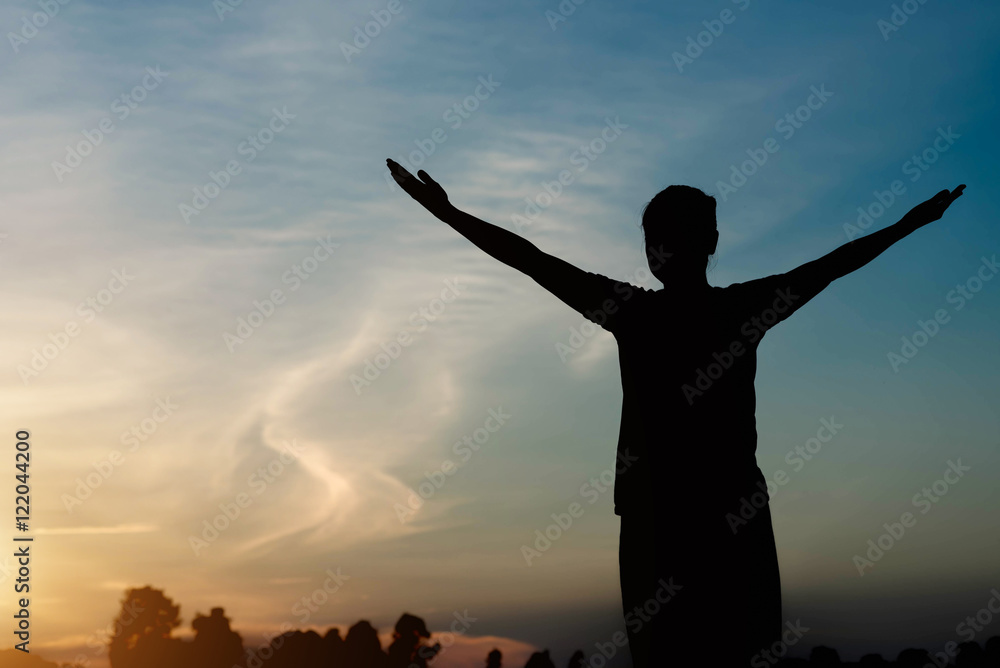 Fototapeta premium silhouette of woman pointing with finger in sky