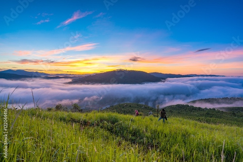 Fog over mountain and forest on sunrise © tongtranson