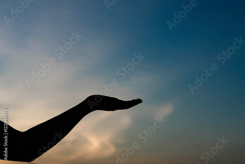 silhouette of woman hands with sunset light