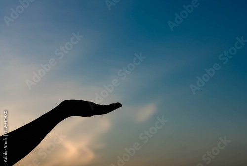 silhouette of woman hands with sunset light © stcom