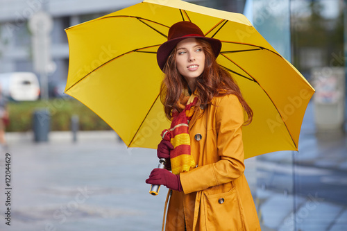 beautiful young woman in autumn city