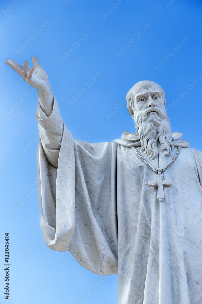 Obraz premium Norcia, Italy. Statue of St. Benedict of Nursia in the square of Saint Benedict 
