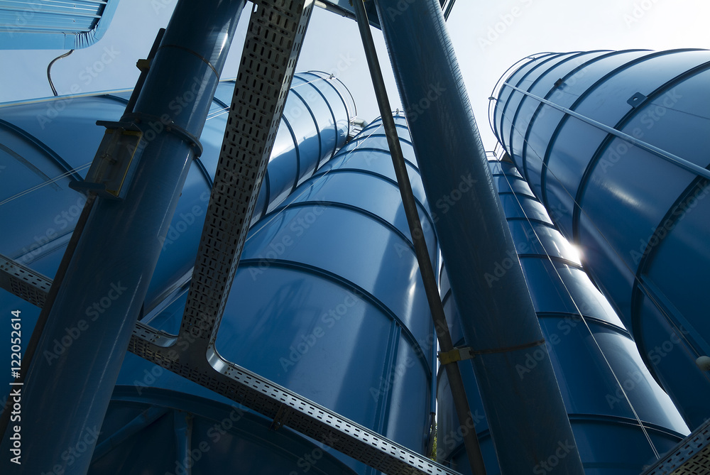 Naklejka premium View from below of Tower Silos Bulk Storage