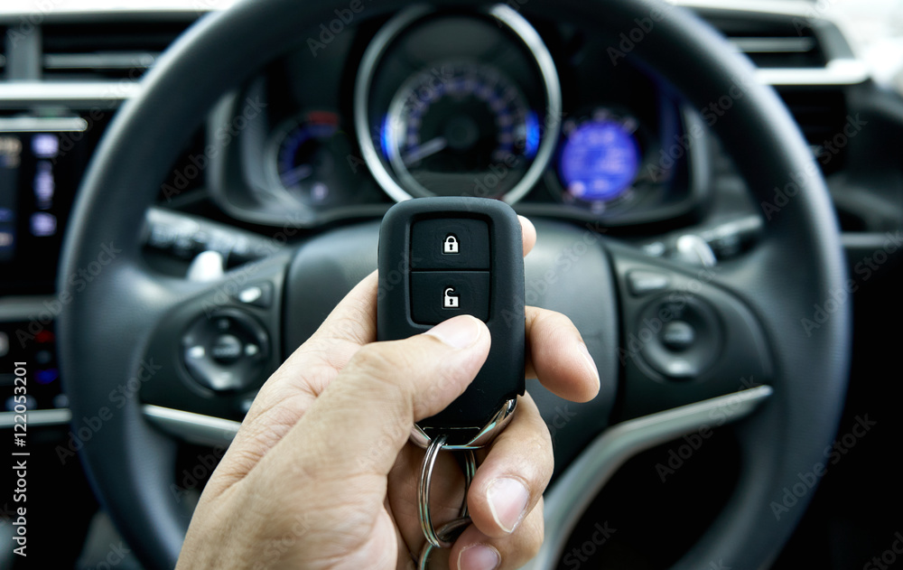 car key on hand inside the car