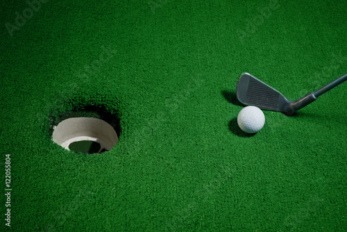 Golf ball and Golf Club on Artificial Grass vignetted