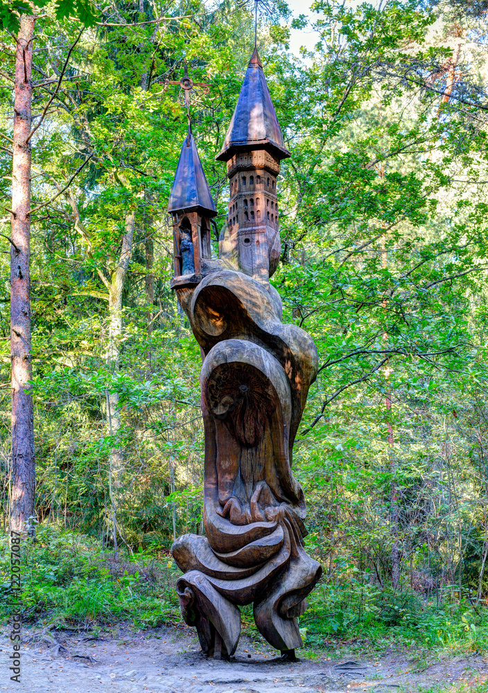 Old wooden sculptures in the forest. Witch Hill park, Lithuania. Old wooden sculptures in the forest. Witch Hill park, Lithuania.