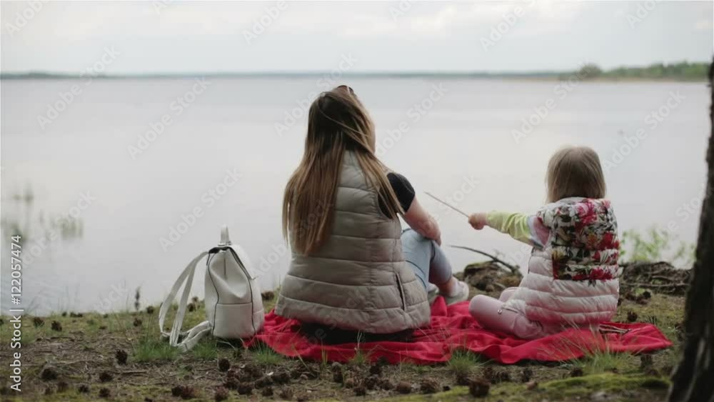 Mother and daughter on the lake on an imaginary fishing. Stock Video ...