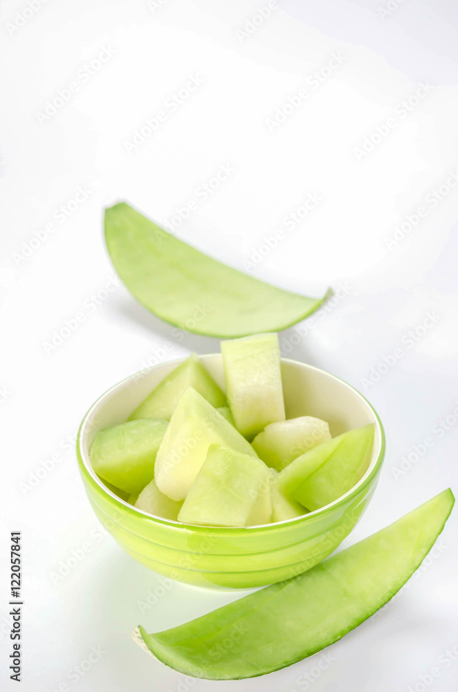 green melon in bowl green melon in bowl