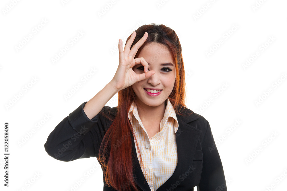 Beautiful young Asian woman show OK sign over her eye. Beautiful young Asian woman show OK sign over her eye.