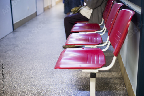 close up on Chairs for patient and visitor in hospital, defocused people