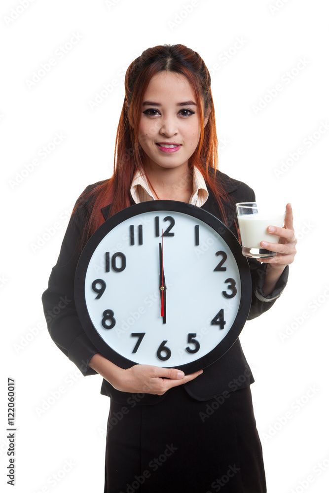 Healthy Asian woman drinking glass of milk hold clock. Healthy Asian woman drinking glass of milk hold clock.