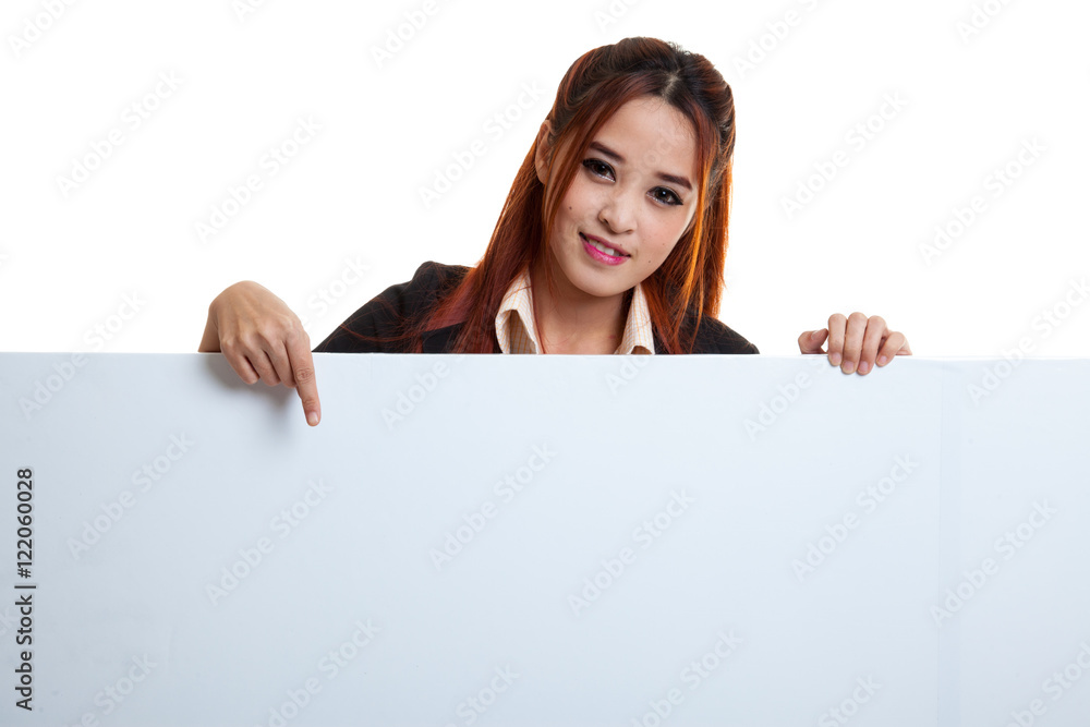 Young Asian woman point to a blank sign. Young Asian woman point to a blank sign.