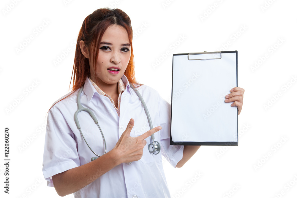 Angry Asian young female doctor point to blank clipboard. Angry Asian young female doctor point to blank clipboard.