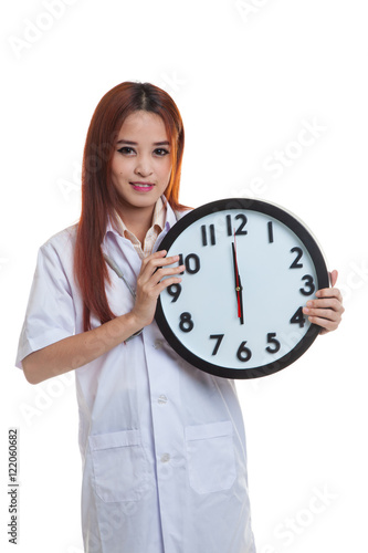Frustrated Young Asian female doctor with a clock.