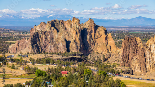 River flowing in the valley against the background of sharp rocks. Beautiful landscape of yellow sharp cliffs. Smith Rock state park, Oregon