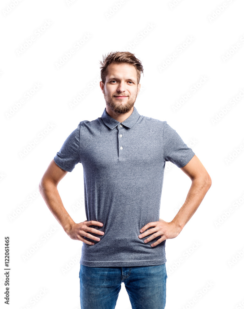 Hipster man in jeans and t-shirt, studio shot, isolated Hipster man in jeans and t-shirt, studio shot, isolated