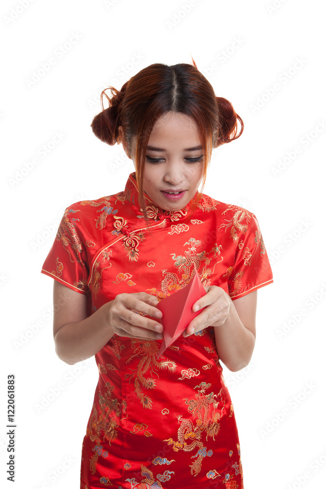 Asian girl in chinese cheongsam dress with red envelope. Asian girl in chinese cheongsam dress with red envelope.