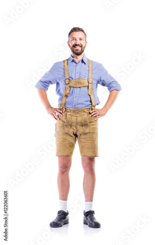 Man in traditional bavarian clothes, hands on hips photo