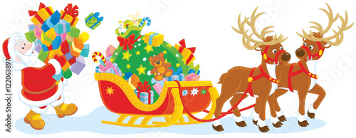 Santa Claus carrying a pile of Christmas gifts to load his sleigh