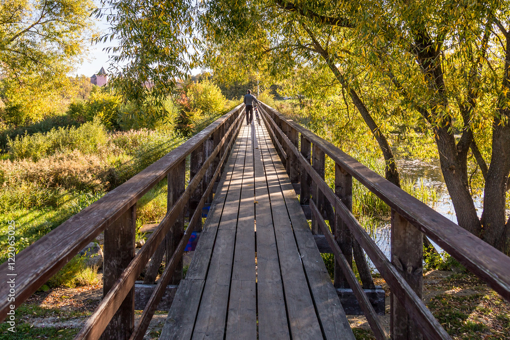 wide angle wooden bridge over river