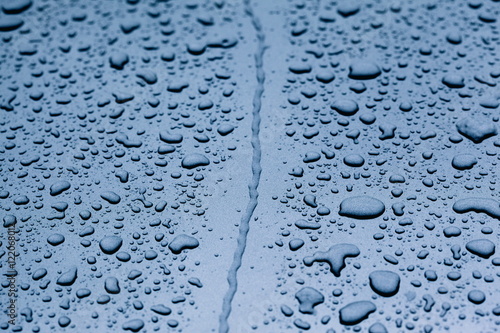 Water and Raindrops on Blue Metal Car 