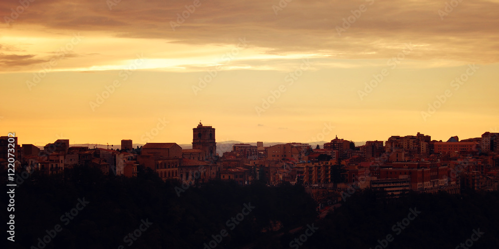 Scenic view of Enna morning. Vintage effect. Mediterranean town. Typical Sicilian cityscape. Retro filter photo. Quiet autumn evening. Sicily, Italy. Wide format.