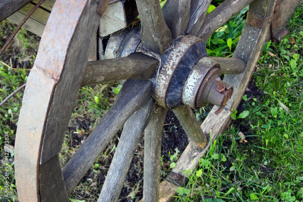 Wooden wheel of the retro village cart