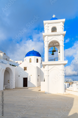 White church with blue dome in Imerovigli village, Santorini isl