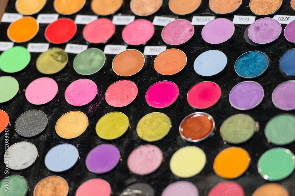 Colorful make-up eye shadows palette. Makeup background. Colorful make-up eye shadows palette. Makeup background.