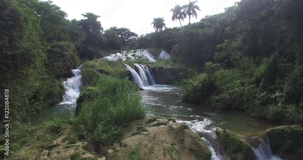 Shooting from the drone of waterfall in a jungle which is falling into tropical lake at summer sunny day
Shooting from the drone of waterfall in a jungle which is falling into tropical lake at summer sunny day