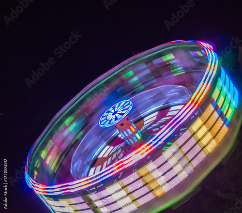 the blur of colors and people when the  ride starts spinning and tilting  pushing them against the wall 
