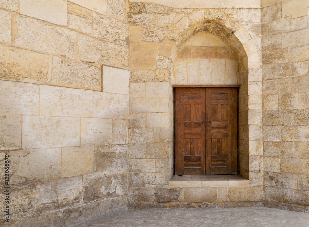 Old wall with a historic decorated bronzed door in the blue Mosque, an old historical mosque, Cairo, Egypt￼