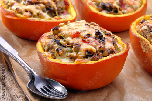 Autumn stuffed pumpkin with rice and mushrooms