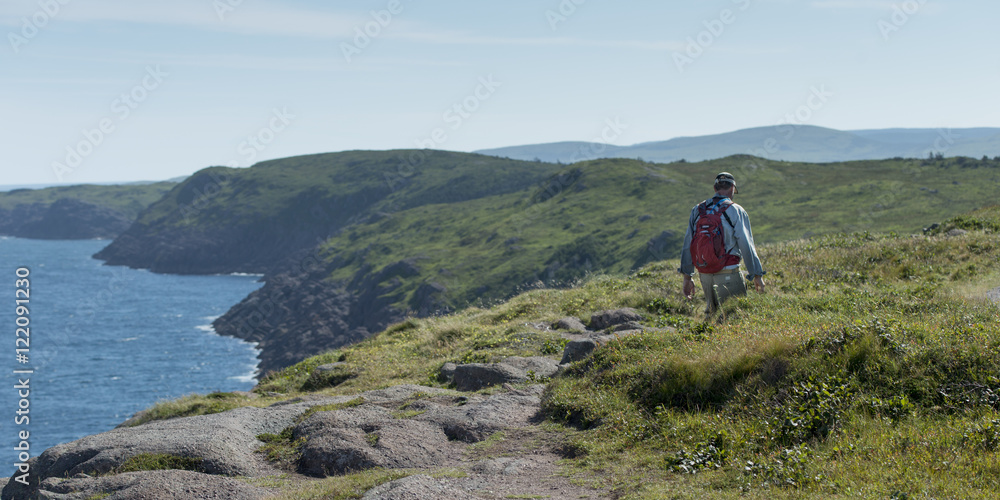 Man hiking, Avalon Peninsula, Newfoundland, Canada