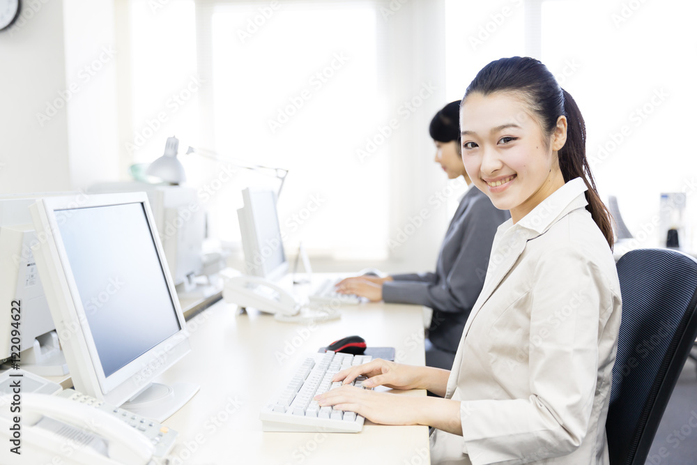 asian businesswomen typing keyboard in the office asian businesswomen typing keyboard in the office