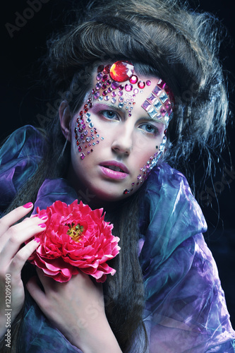 woman in creative image  with big flowers. © Raisa Kanareva