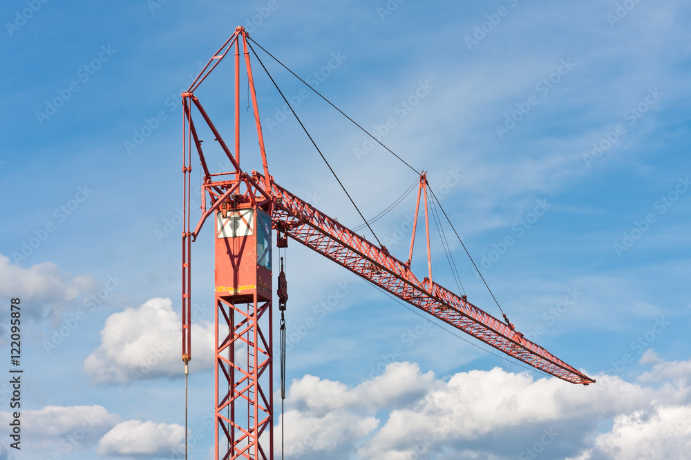 Small construction crane and the cloudy sky Small construction crane and the cloudy sky