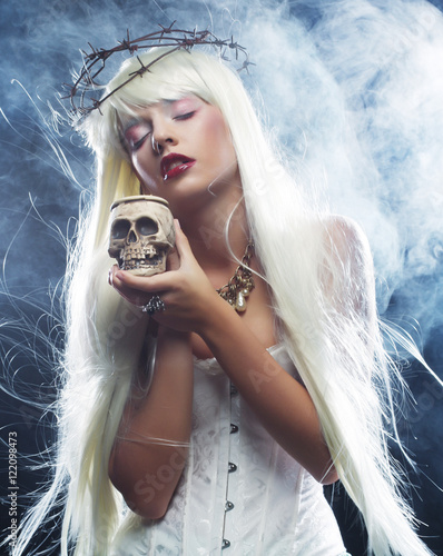 angelic long hair woman with skull photo