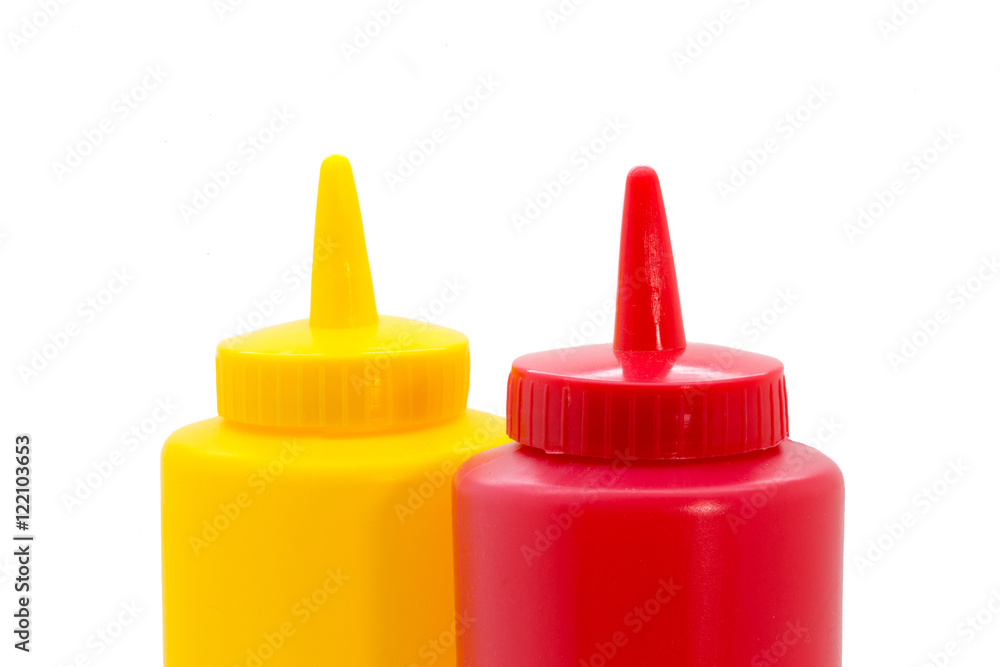 Top of a ketchup and mustard bottle closeup Top of a ketchup and mustard bottle closeup