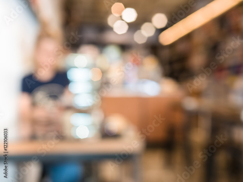 woman sitting in cafe, blurred bokeh for background