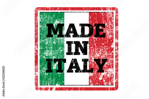 MADE IN ITALY word written on red rubber stamp and flag with grunge edges.