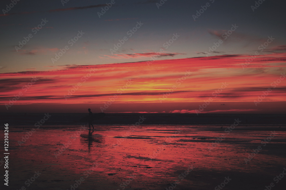 Colourful sunset over the beach at Polzeath Vintage Retro Filter