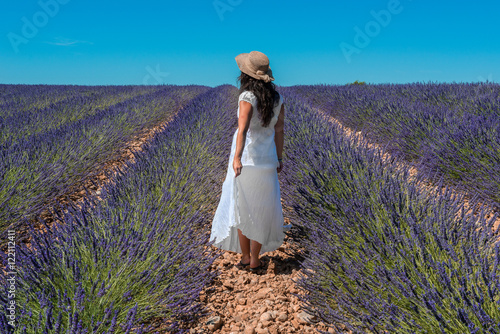 Girl in a lavender field in Valensole plateau, Provence (France)