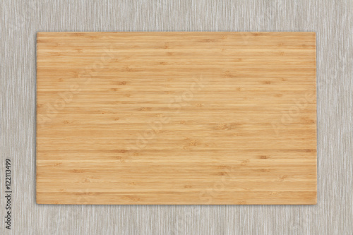 blank block or wooden cutting board for food preparation on tabl