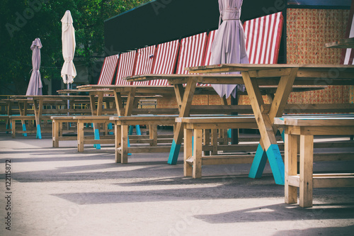 Fototapeta Naklejka Na Ścianę i Meble -  wooden tables and benches, playground at the fair