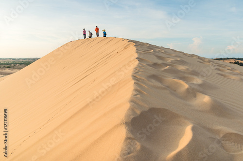 White sand dunes in desert on sunrise