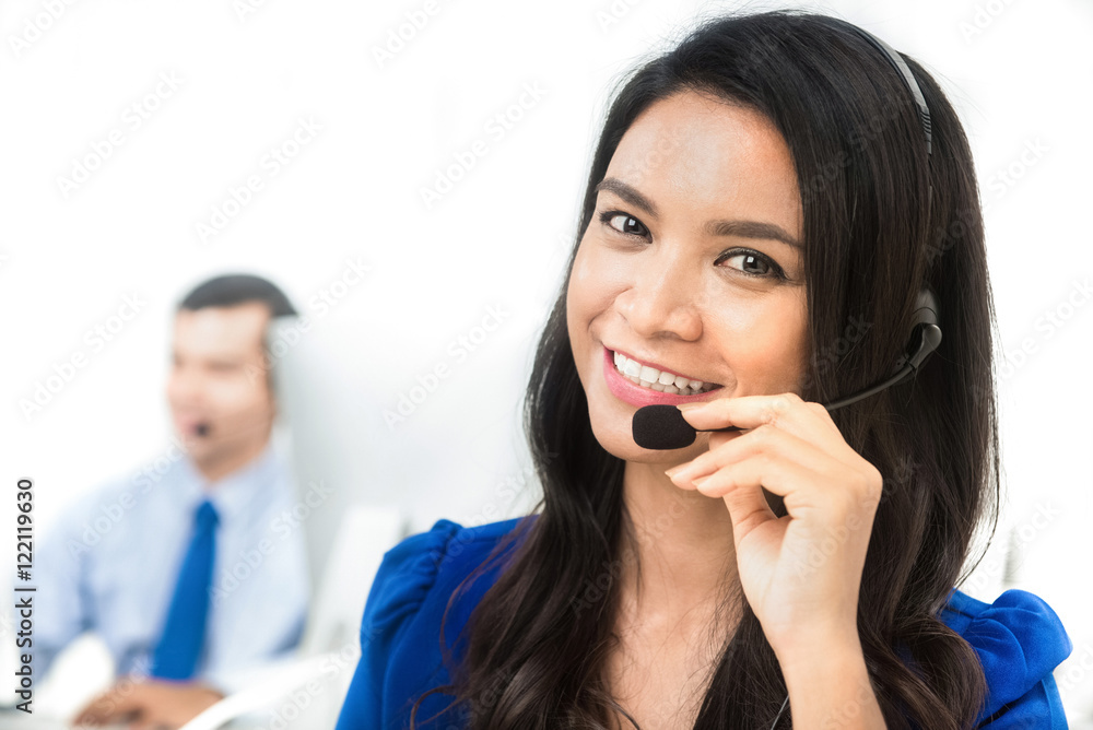 Asian businesswoman working as an operator in call center Asian businesswoman working as an operator in call center