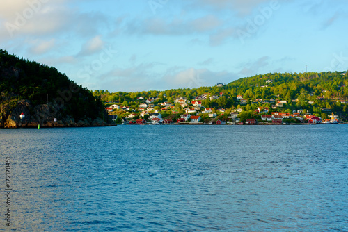 The Norwegian town of Sponvika as seen in late afternoon from the Swedish side of the fiord.