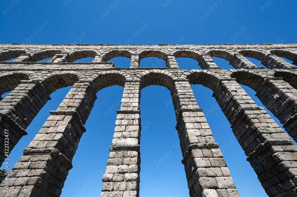 Views of the Aqueduct of Segovia, Spain. It is a roman aqueduct and the date of construction cannot be definitively determined Views of the Aqueduct of Segovia, Spain. It is a roman aqueduct and the date of construction cannot be definitively determined